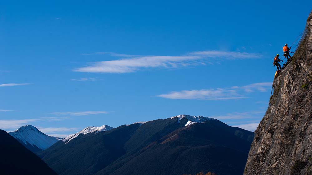 Vertech NZ climbers on cliff face.